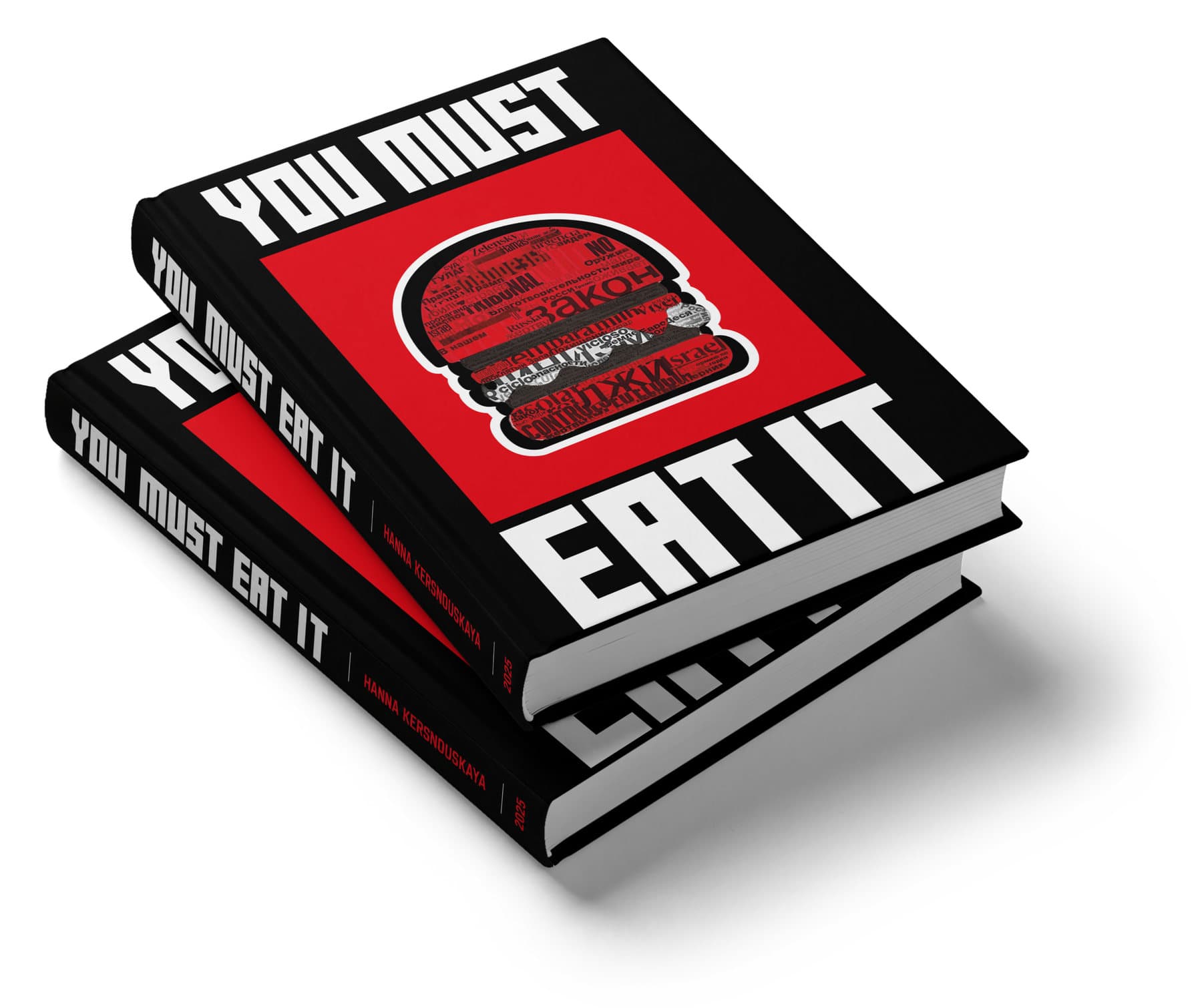 Two copies of the hardback stacked at an angle: black cloth boards with YOU MUST set in heavy white capitals above a red panel and EAT IT below it, cropped by the edges of the case. The panel holds a hamburger drawn entirely out of newspaper words in Russian, Portuguese and English. The spine repeats the title in white with the author's name and 2025 in red.